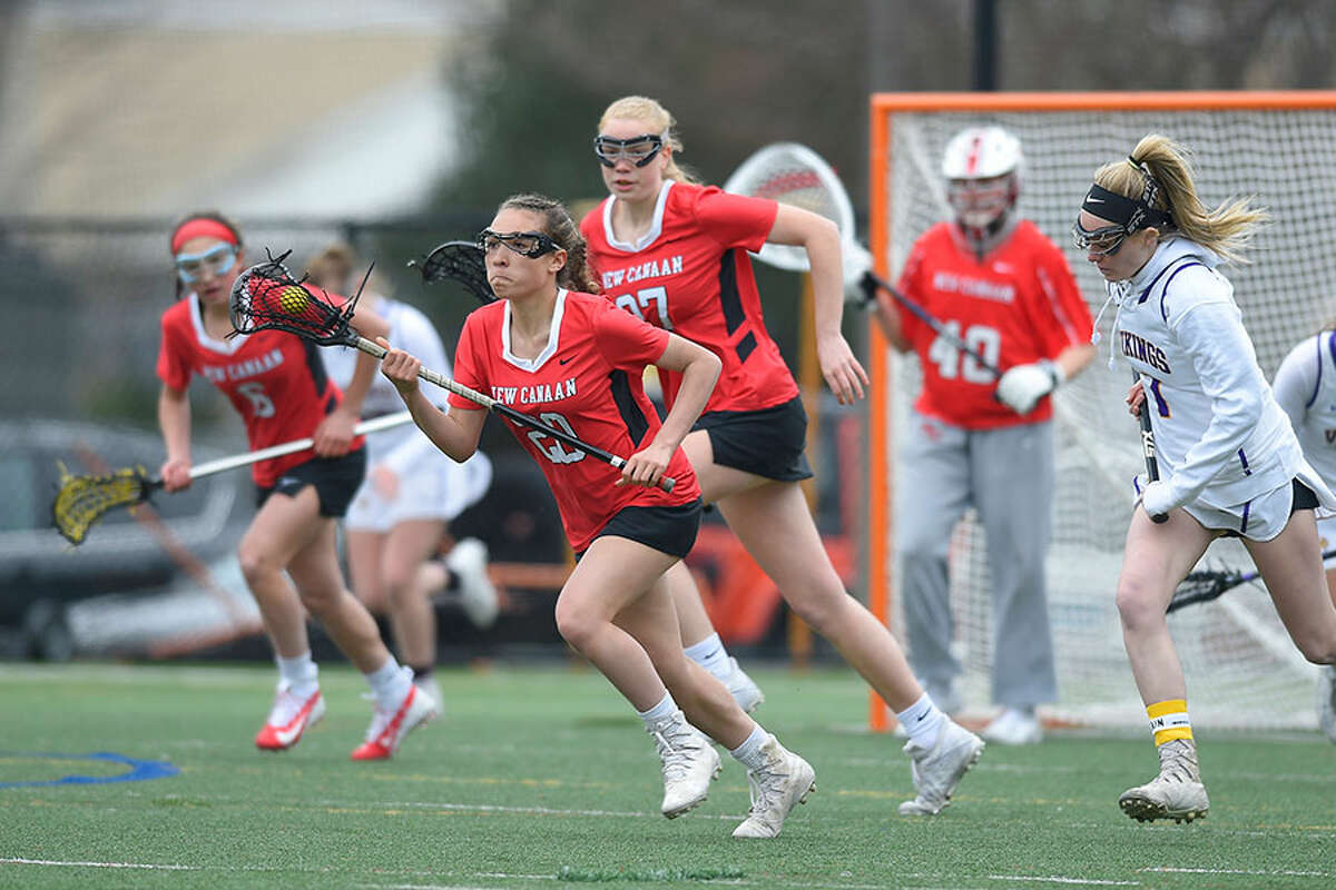 New Canaan's Quincy Connell breaks out of the defensive zone during a Ram victory over Westhill on April 2. — Matthew Brown/Hearst Connecticut Media
