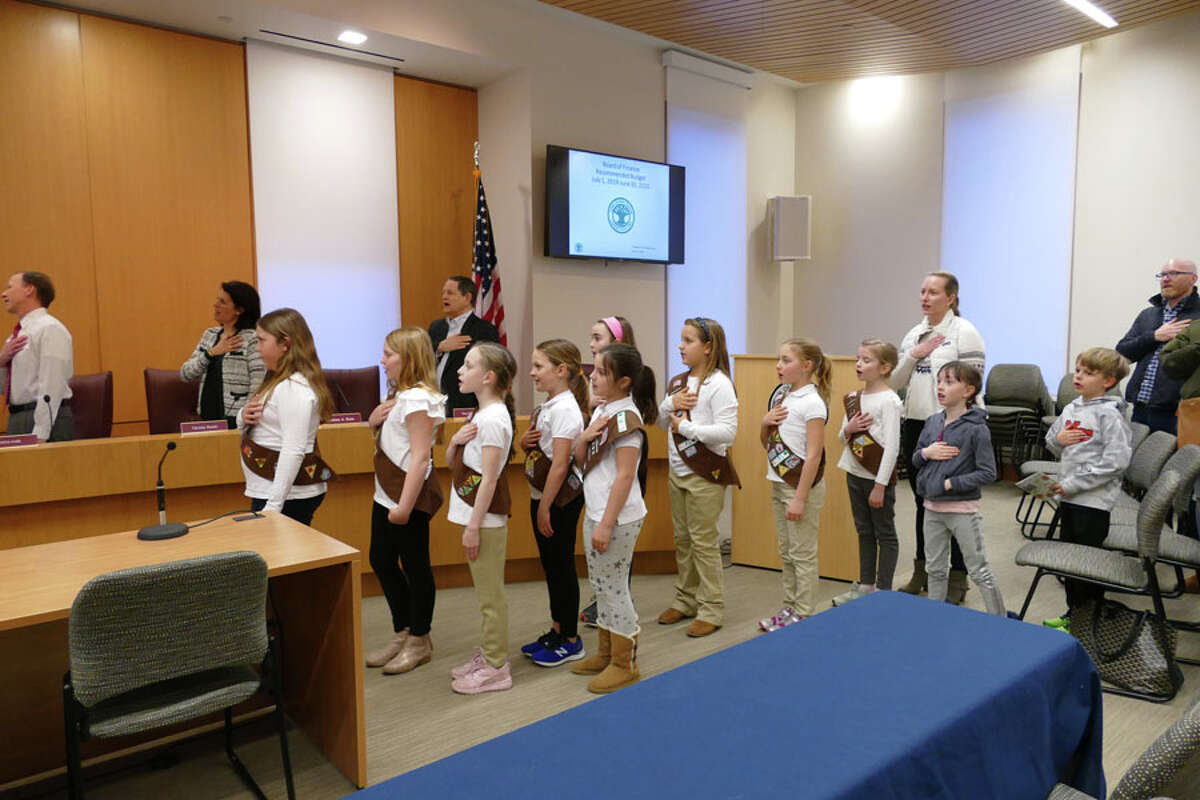 Girl Scout Troop 292 led the Town Council in the Pledge of Allegiance in keeping with the council's tradition before starting a meeting. — Grace Duffield / Hearst Connecticut Media