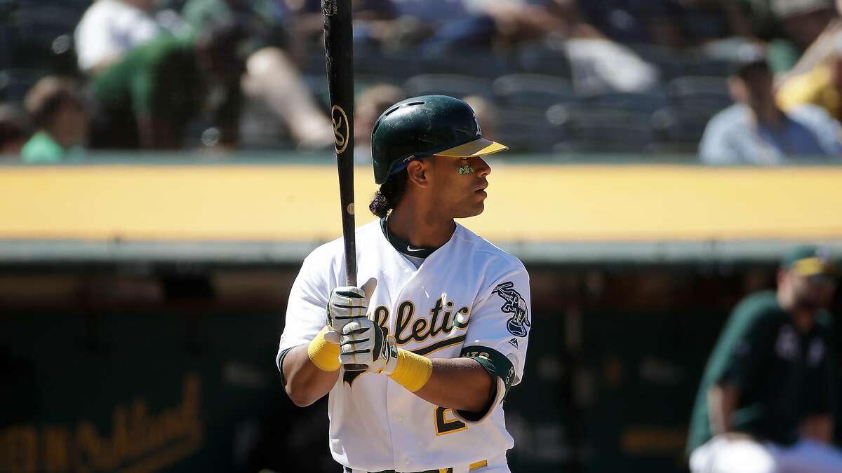 Oakland Athletics' Khris Davis bats against the Tampa Bay Rays during a baseball game in Oakland, Calif., Sunday, June 23, 2019. (AP Photo/Jeff Chiu)