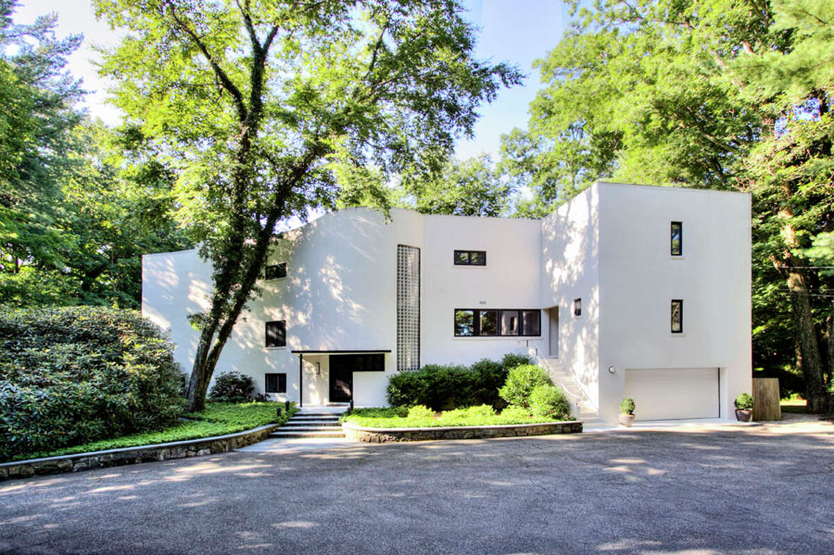 William Pitt Sotheby’s International Realty agents recently hosted a combination art show and property tour at this Darien home designed by Frank Lloyd Wright collaborator Arthur Holden, which the two agents are co-listing. — William Pitt Sotheby's International Realty / Contributed photo