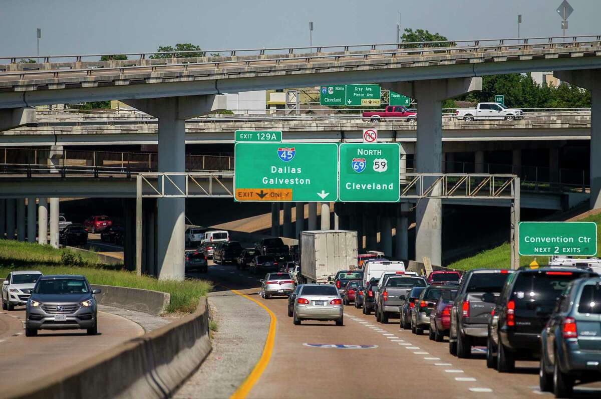 Drivers merge between lanes leading to Interstate 45 and Interstate 69 traveling northbound on I-69 in downtown Houston on June 12, 2019. Houston area commuters waste 75 hours in traffic annually, according to a new report from the Texas A&M Transportation Institute.