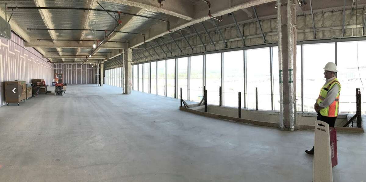 Half of the enormous space that will house American Airlines Admirals Club opening October 2020