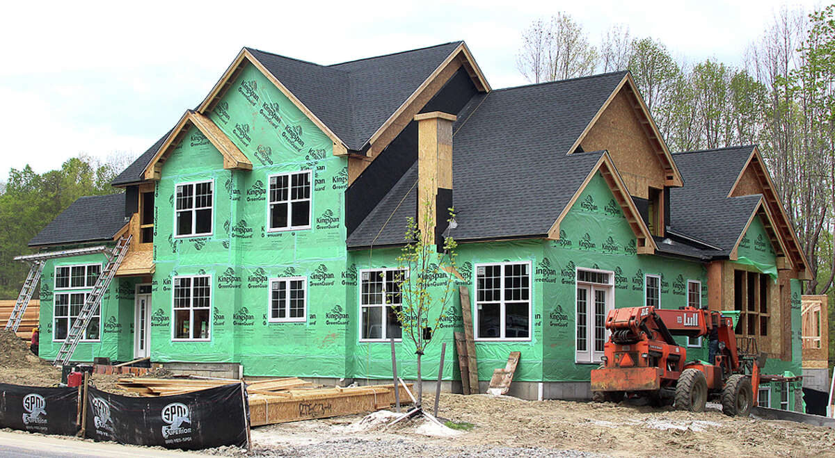A Toll Brothers home under construction in Danbury, Conn. in May 2017. Toll Brothers is one of 100 publicly traded companies whose stocks are indexed in the HOMZ exchange-traded fund that debuted this month by Norwalk-based Hoya Capital Real Estate. — Chris Boask / Hearst Connecticut Media