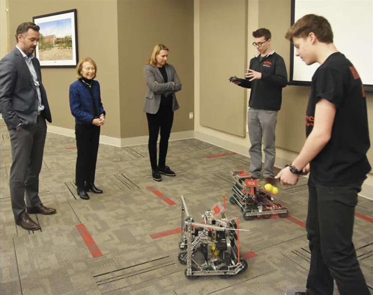 The New Canaan High School robotics team is headed to regionals. New Canaan High School Vex Robotics team members Ben Levin and Mark Levin (far right) make an informal presentation to Board of Education Chairman Brendan Hayes, member Hazel Hobbs, and Vice Chairman Dionna Carlson.