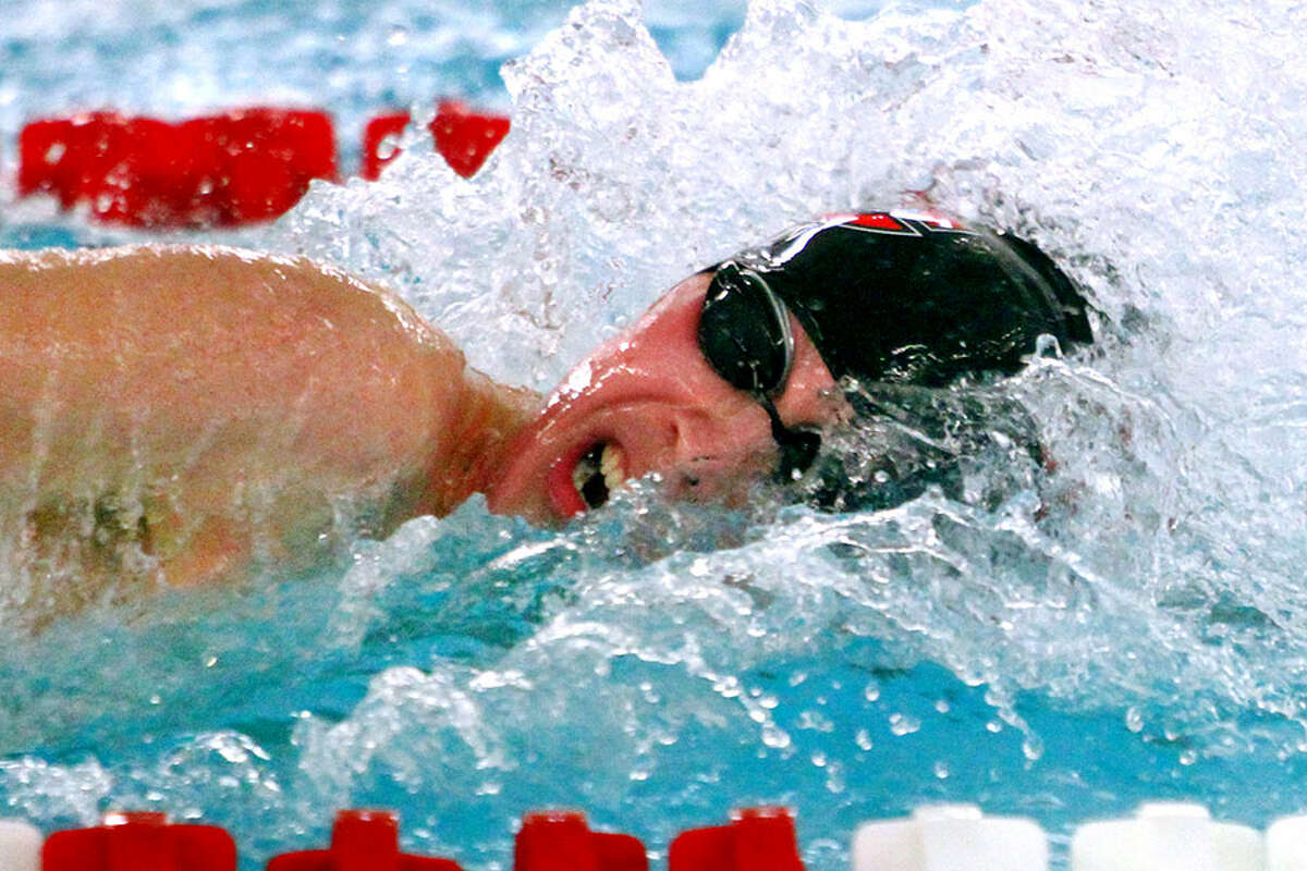 New Canaan's Jake Ritz competes in the 400 yard freestyle realy during swim action against Greenwich in Greenwich, Conn., on Friday Jan. 11, 2019. — Christian Abraham/Hearst Connecticut Media photo
