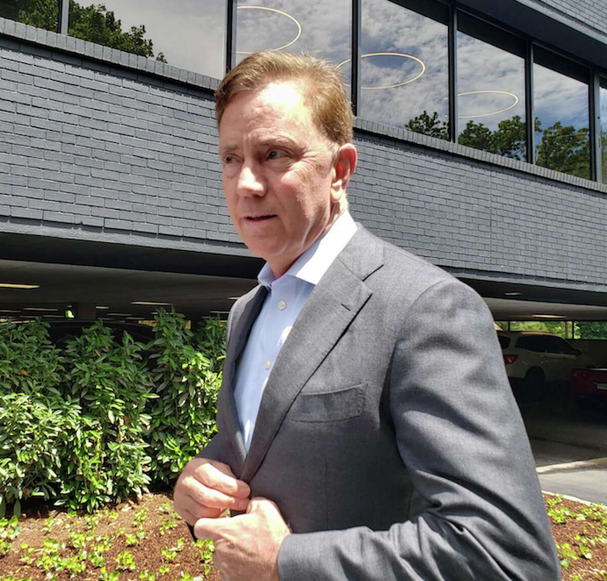 Governor Ned Lamont talks outside of HAYVN in Darien on Tuesday, June 11. - Sandra Diamond Fox photo