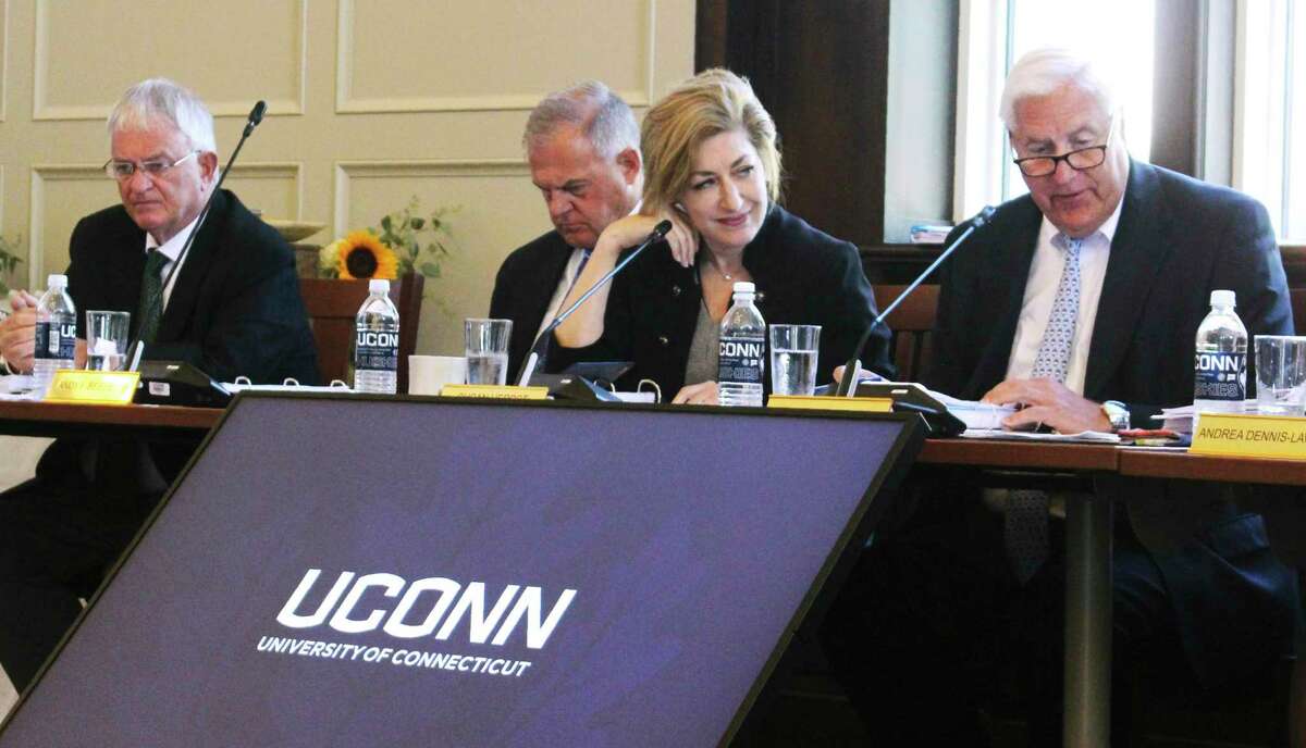 UConn Board of Trustees members, from left, Denis Nayden, Andy Bessette, UConn President Susan Herbst, and interim board chairman Tom Ritter, attend a public board meeting, Wednesday. The board voted to accept an invitation to move most of the school's athletic teams from the American Athletic Conference to the Big East.