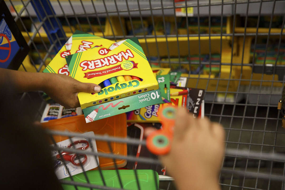 Customers browse Crayola school supplies displayed for sale at a Wal-Mart Stores Inc. location in Burbank, Calif., on Aug. 8, 2017.