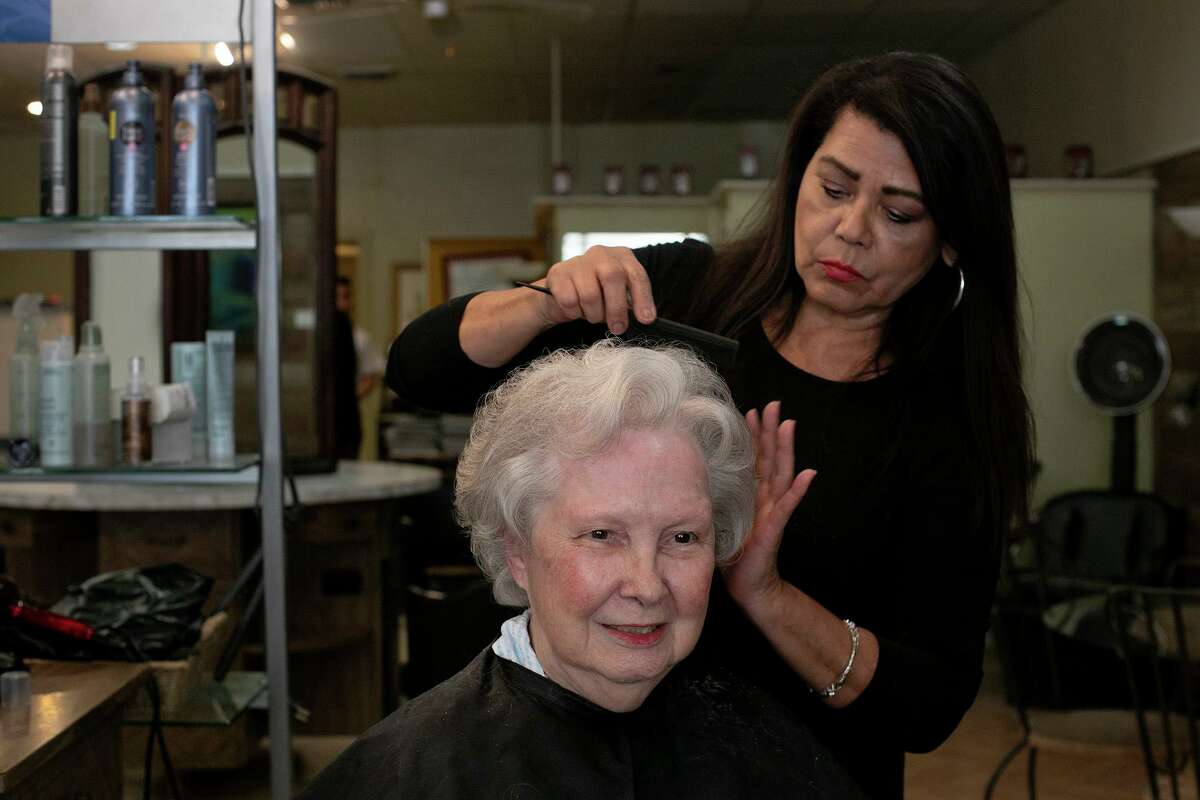 Adrienne Weynand, 91, gets her hair styled by Mary Morales, the owner of Vee's Hair and Spa, at the salon in San Antonio. Vee’s first opened in 1948 as Bowman’s Beauty Salon.