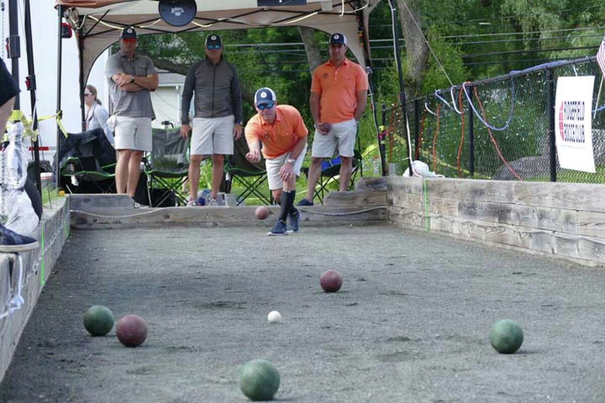Left to right: Kristian Ording and Mike Rosella (from Team BGC), Chris Forsyth (throwing the ball) and Bill Diamond (from Team ROAR)