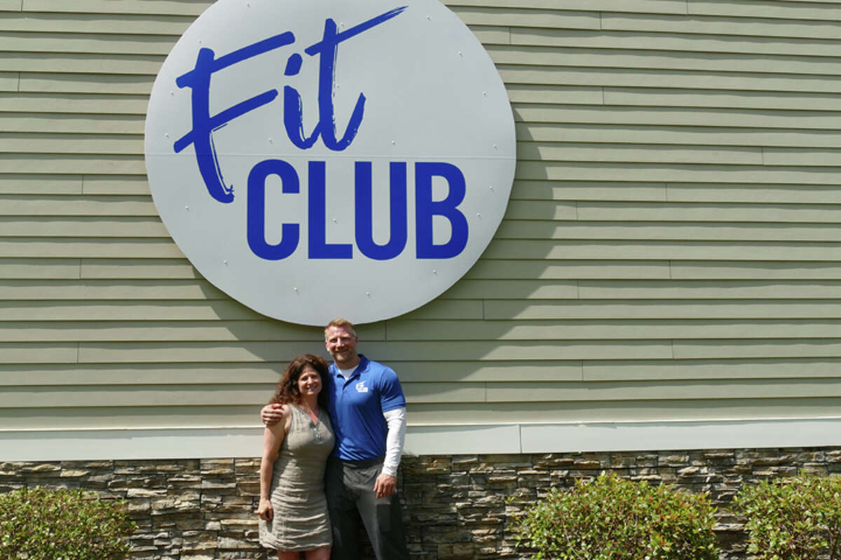 Fit Club co-owners Jenny Conciatore and Mike Subach stand beneath the new sign at 66 Grove Street. Conciatore is the business’ general manager and Subach is the head trainer. They have been helping clients at 66 Grove Street for 14 and 15 years, respectively. Conciatore and Subach began renovating the building in March and opened as Fit Club on May 15. — Steve Coulter / Hearst Connecticut Media
