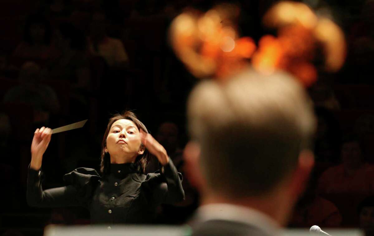 Akiko Fujimoto, the new conductor of the Mid-Texas Symphony, conducts a San Antonio Symphony Halloween concert in 2014.
