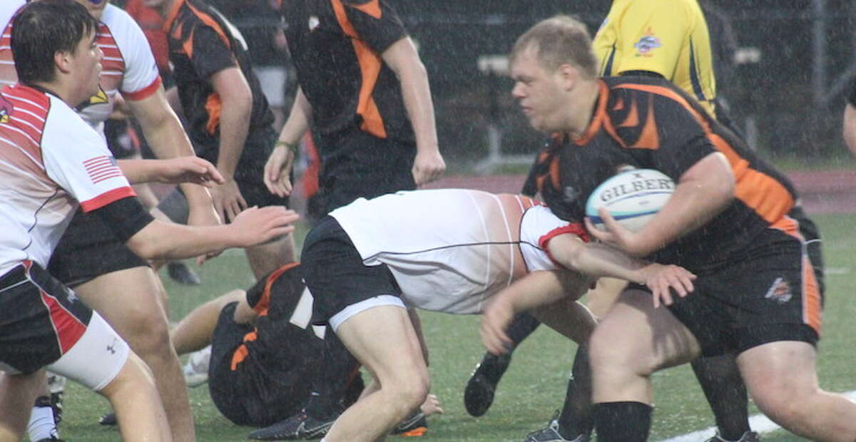 Peter Behnke powers into the try zone during Ridgefield's win over Greenwich in the Division 2 rugby state semifinals.