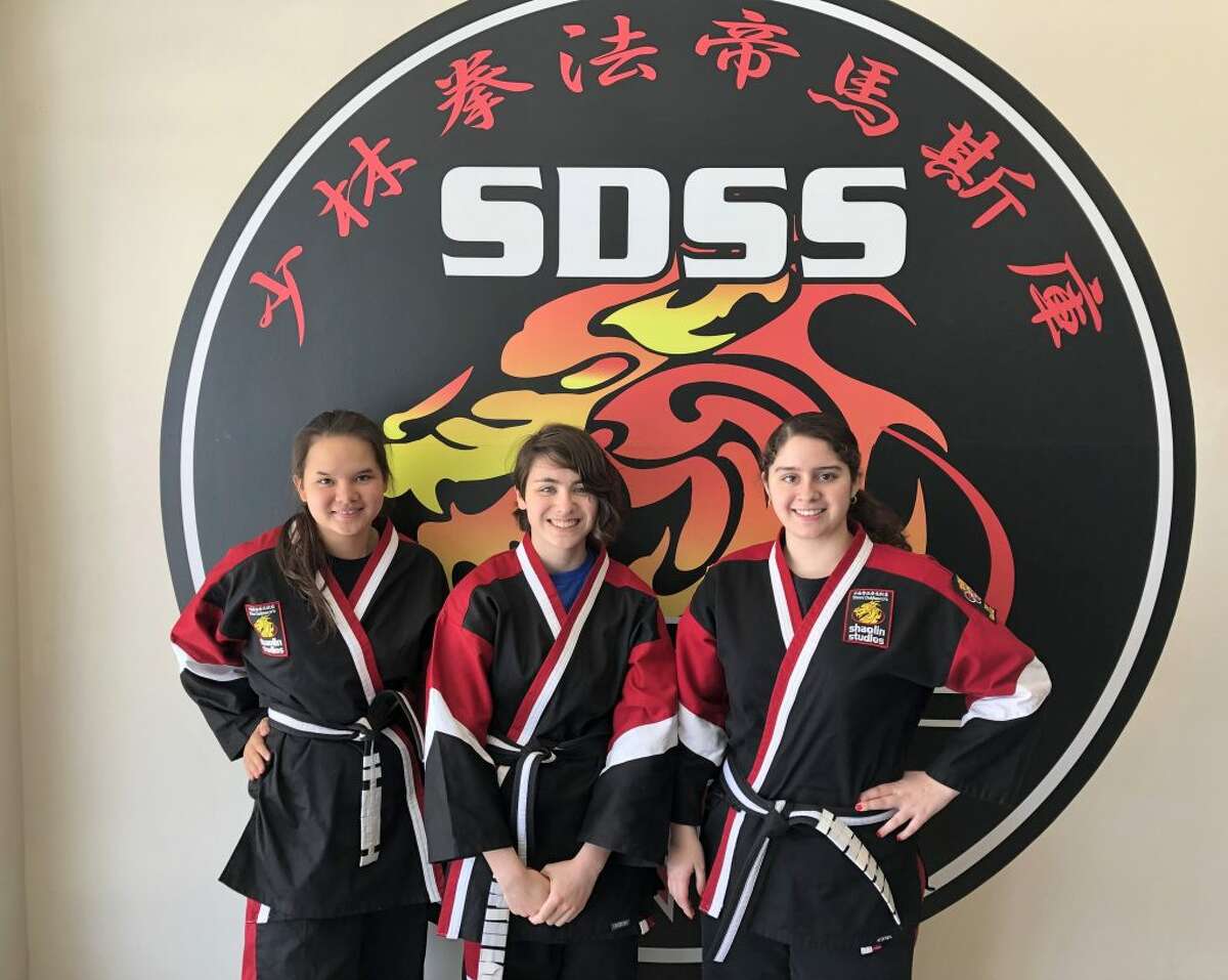 Ridgefield High School students Grace Goldberg, Nina Kropas and Antonella Risi earned their Zhongi Black Belt on April 27. They are part of Steve DeMasco's Shaolin Studios in Ridgefield and have been training for about nine years to reach this accomplishment.