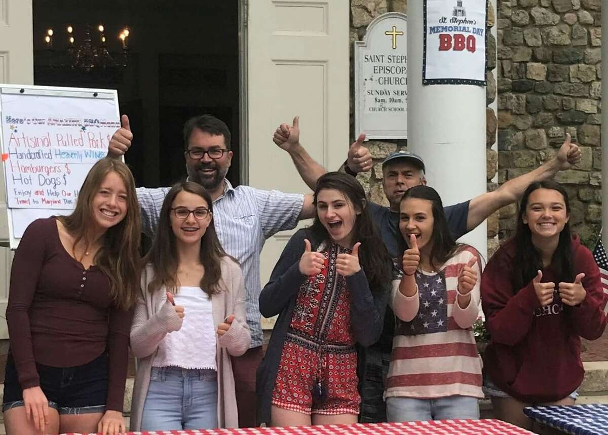 Participants in last year’s H.O.P.E. trip helped Mark Blandford and his crew at St. Stephen’s 2018 Memorial Day BBQ (left to right): Kirsten Pastore, Emily Brown, Mark Blandford, Molly Reiss, Jim Brown, Taylor Brown, and Kayleigh Bowler.