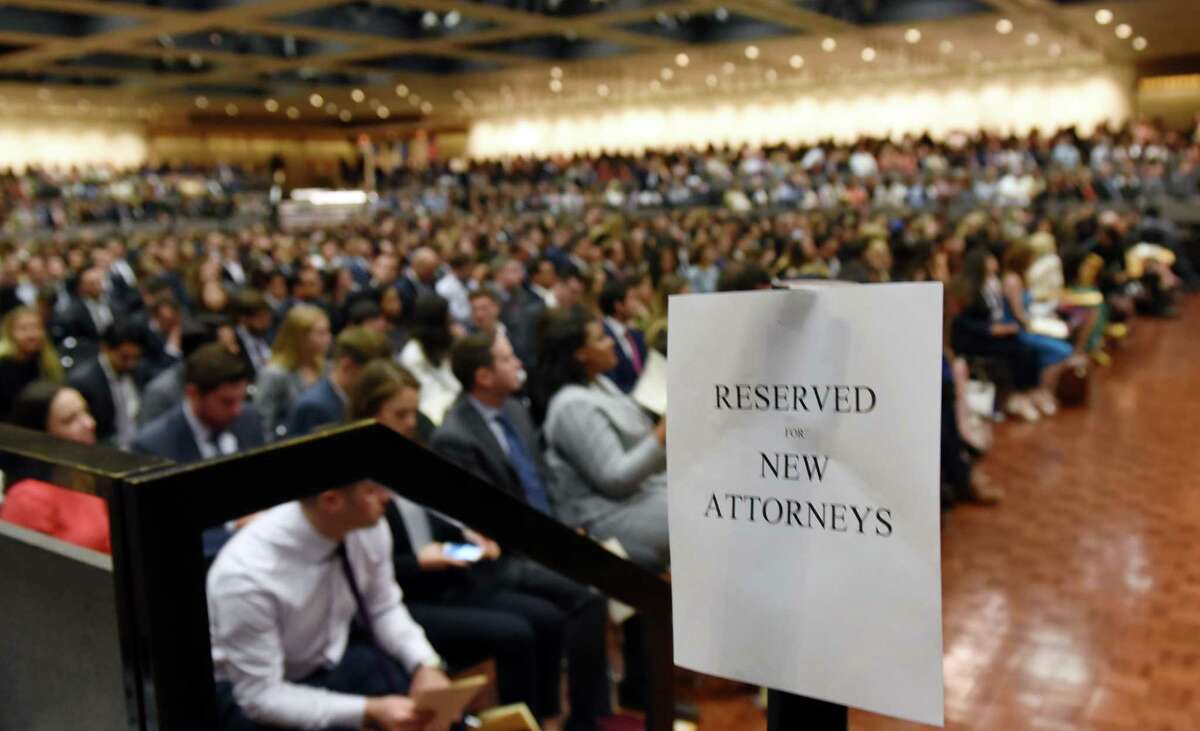 A sign indicates the seating section for the newly admitted members of the New York State Bar during a ceremony to admit new members into the New York State Bar on Wednesday, June 26, 2019 at the Empire State Plaza Convention Center in Albany, NY. (Phoebe Sheehan/Times Union)