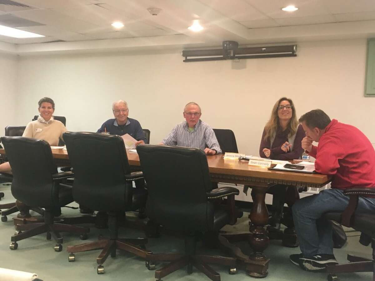 Ridgefield's Board of Finance deliberates in the lower level conference room in Town Hall Tuesday night. The Finance Board set the town's mill rate to 28.12 mills for the 2019-20 fiscal year after the town and school budgets passed at referendum Tuesday.