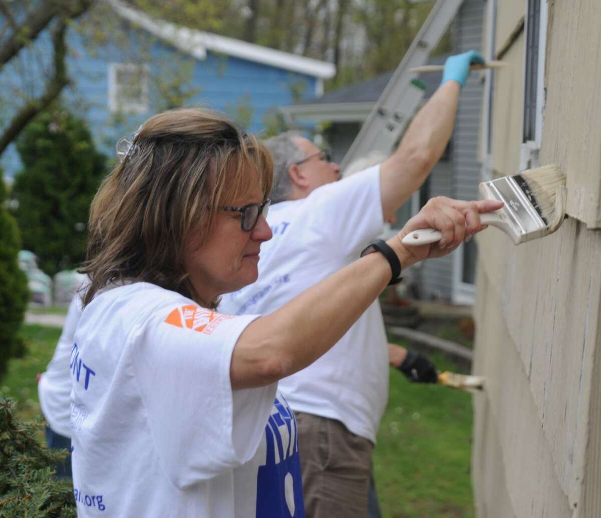 Lori Peterson painted as part of a volunteer crew fixing up a house as part of HomeFront Day on May 4, 2019.