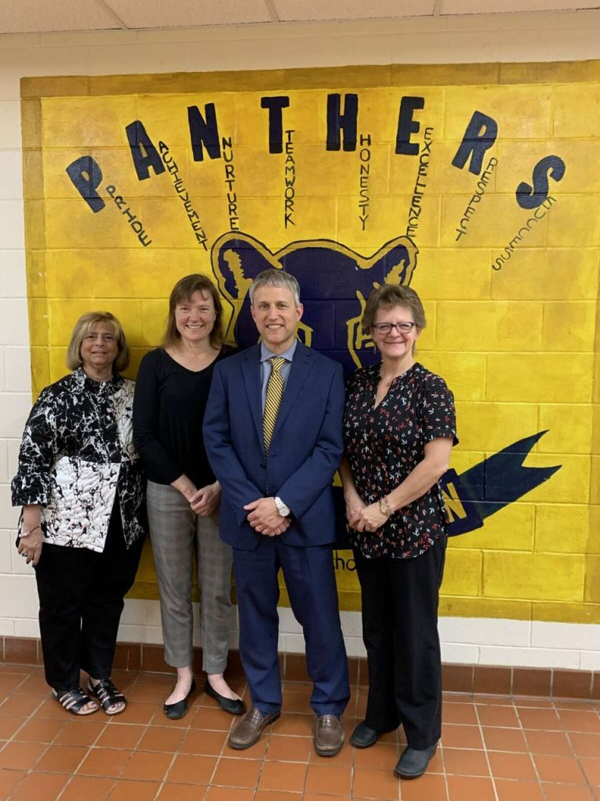 Madison Middle School teachers and KARE club advisors Nancy Yarmosh and Jeanne Malgioglio, MMS Principal Peter Sullivan and Binky Patrol co-founder JoAnn Zimmerman.