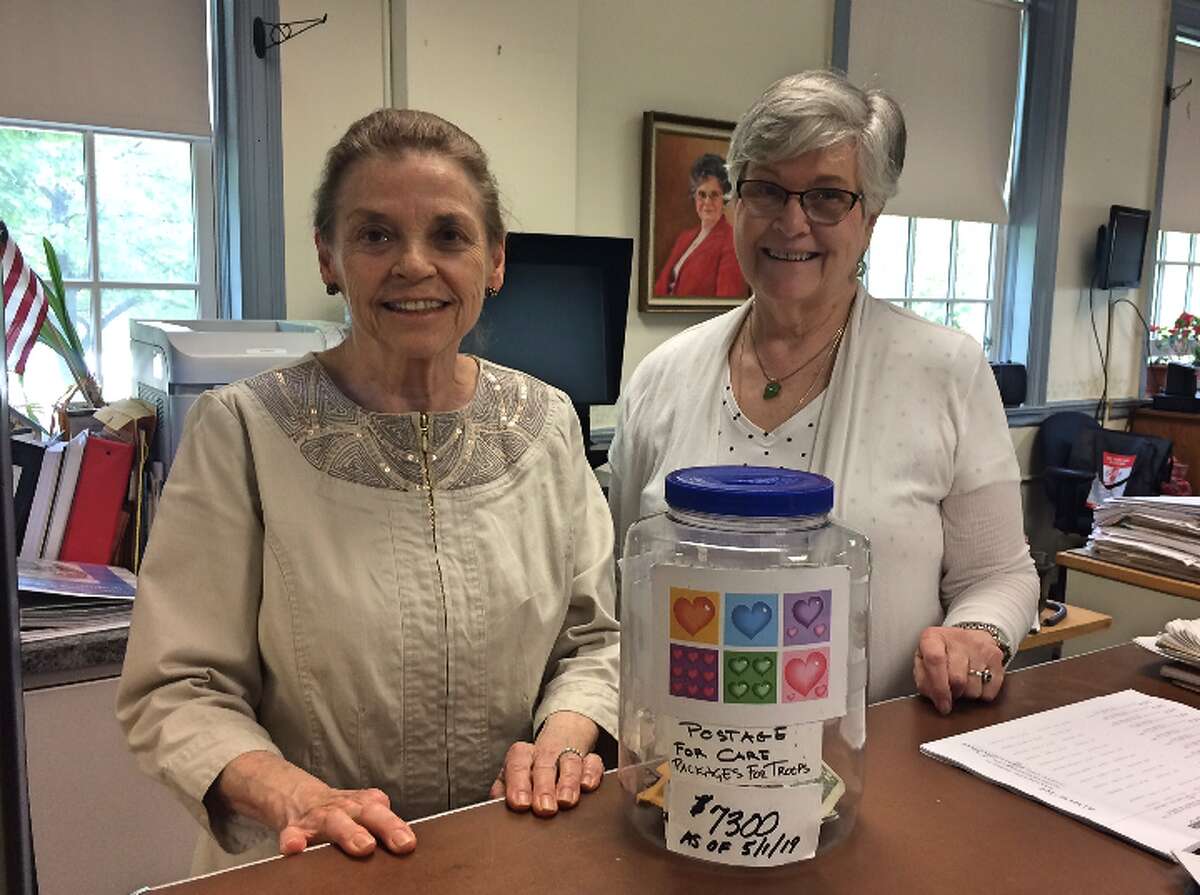 Town Clerk Suzanne Burr-Monaco and Assistant Clerk Gloria Murphy may retire the Care Packages for Troops donation jar that has been a fixture in the office since 2010.