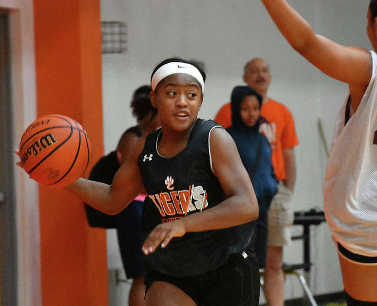 Edwardsville guard Quierra Love prepares to make a pass during a summer scrimmage against EA-WR in the Scott Credit Union Shootout inside Lucco-Jackson Gymnasium last weekend.