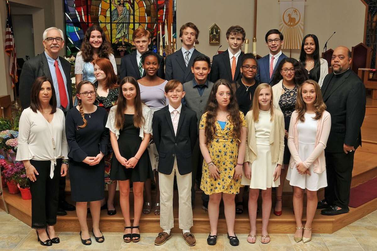 With Our Lady of Fatima graduates are, at left, in front, ELA Middle School Teacher, Danielle Mancuso; at right, middle row, the Rev. Reginald Norman, Our Lady of Fatima Church pastor, and at left, back row, Principal Stanley Steele. - Lifetouch photo