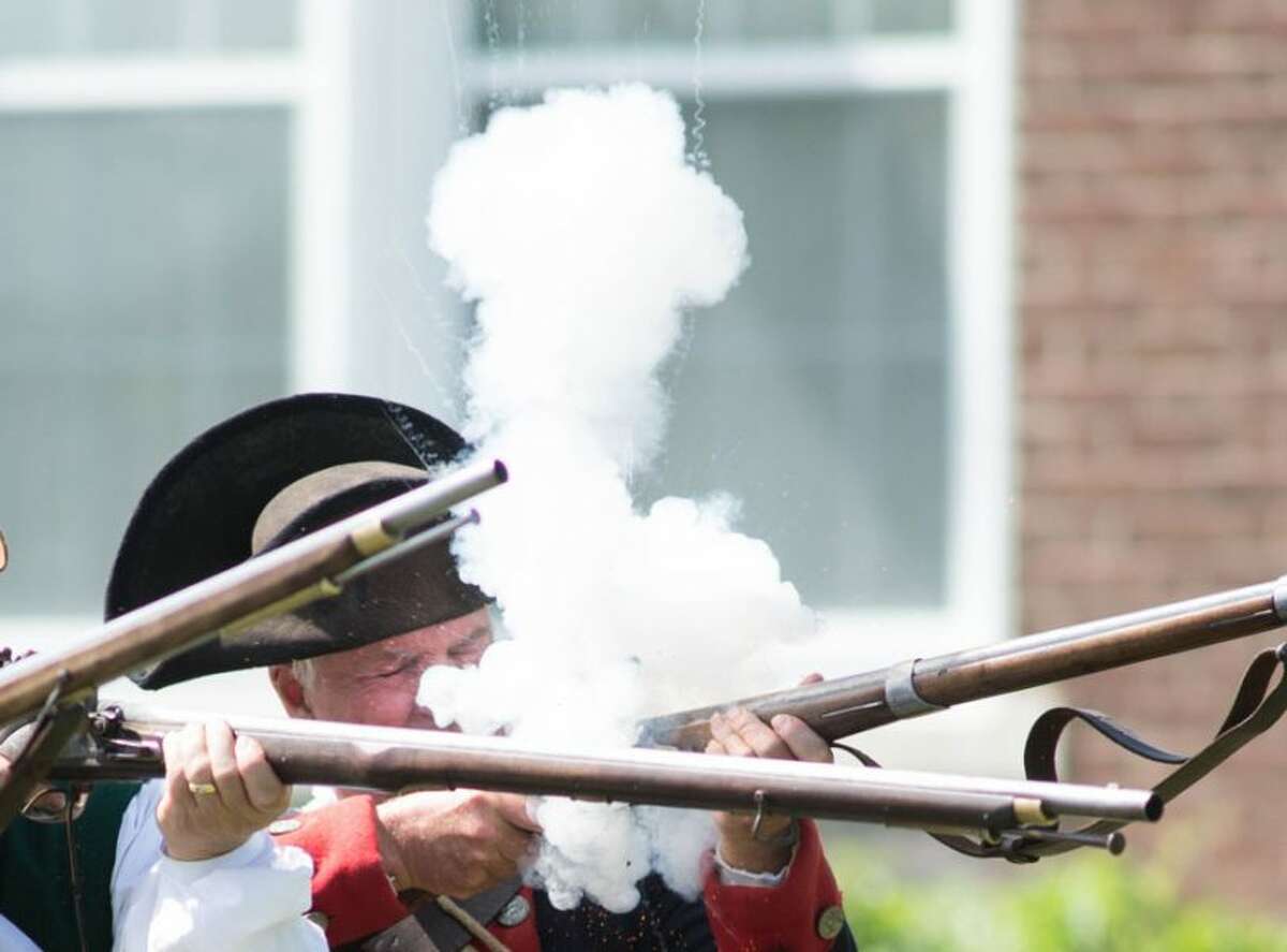 Ready, aim, fire! Roger Smith shoots a musket causing noise and smoke at Living History Day in Bethel. — Bryan Haeffele/ Hearst Connecticut Media photo