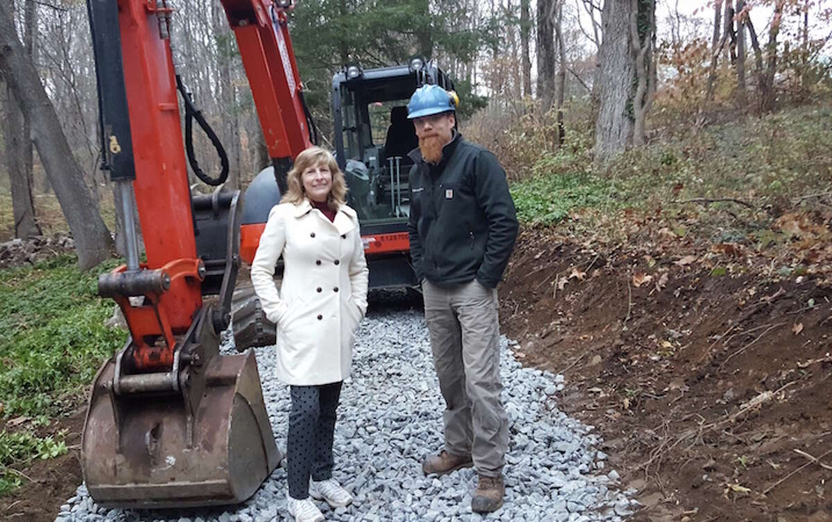 Pat Sesto, president of the Friends of the NRVT, joins trail builder Josh Ryan of Timber & Stone during construction of the Wilton Loop portion of the Norwalk River Valley Trail.