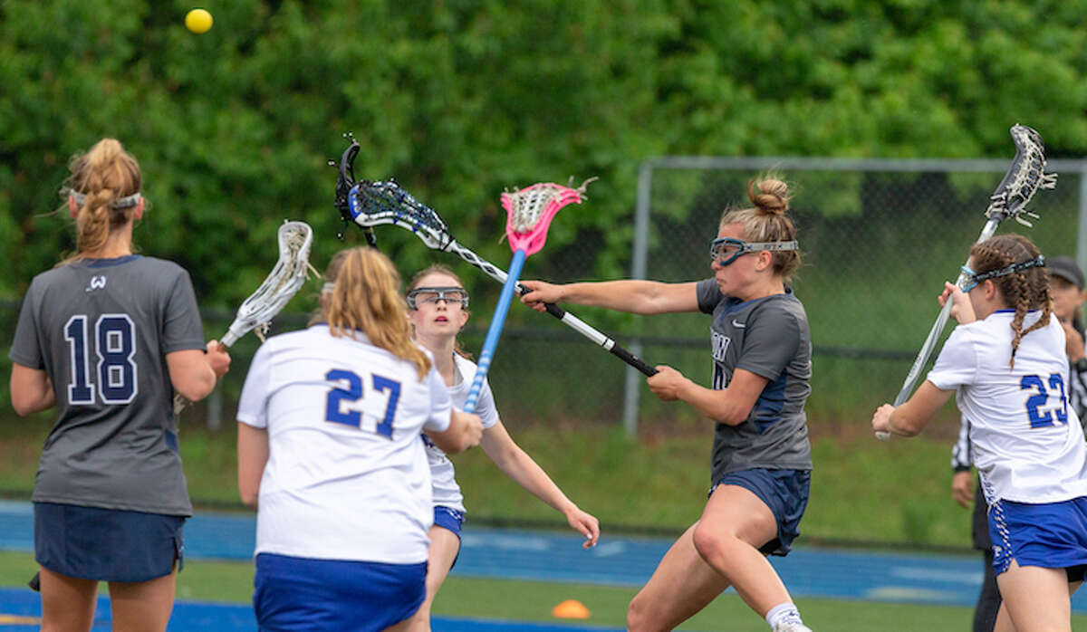 Carly Sullivan scores a goal for Wilton in Tuesday's state tournament win over Newtown. — GretchenMcMahonPhotography.com