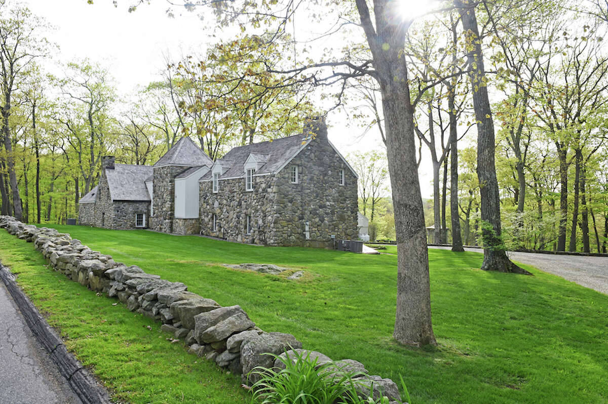 The stone house at 52 Millstone Road is at the center of a dispute between the property owners and the Wilton Land Conservation Trust. - Bryan Haeffele/Hearst Connecticut Media
