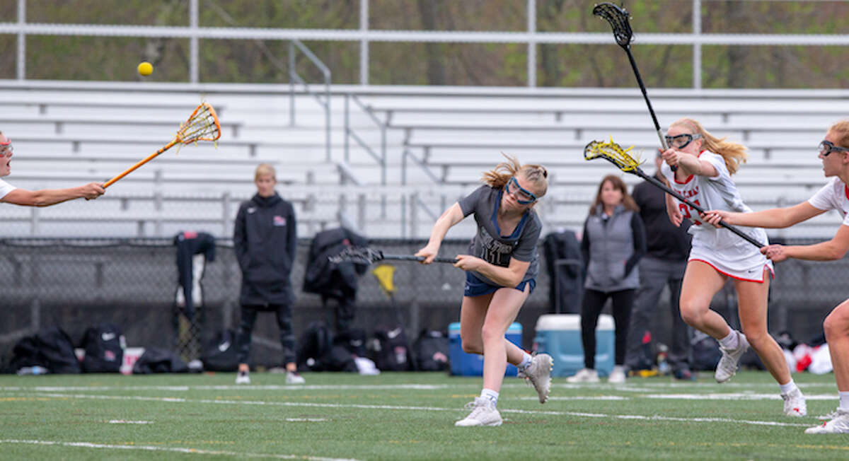 Olivia Gladstein fires a shot during Tuesday night's game against New Canaan. - GretchenMcMahonPhotography.com