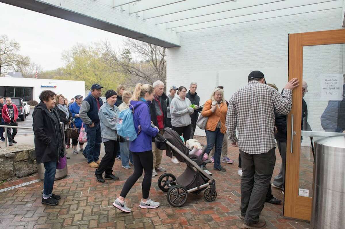 A line forms for the opening of the Annual Gigantic Book Sale at the Wilton Library on Sunday, April 28.