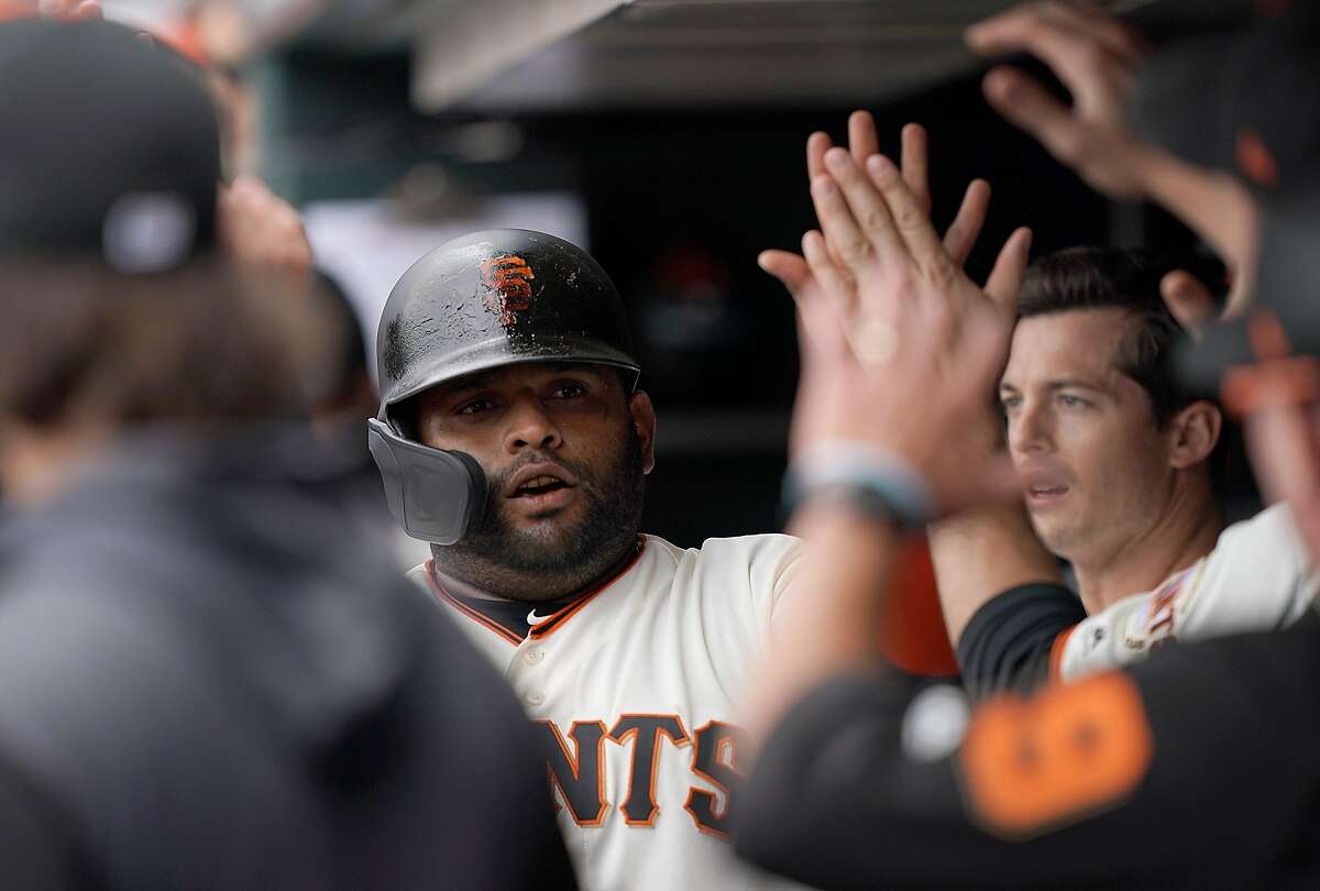 SAN FRANCISCO, CA - JUNE 26: Pablo Sandoval #48 of the San Francisco Giants is congratulated by teammates after scoring against the Colorado Rockies in the bottom of the first inning of a Major League Baseball game at Oracle Park on June 26, 2019 in San Francisco, California. (Photo by Thearon W. Henderson/Getty Images)