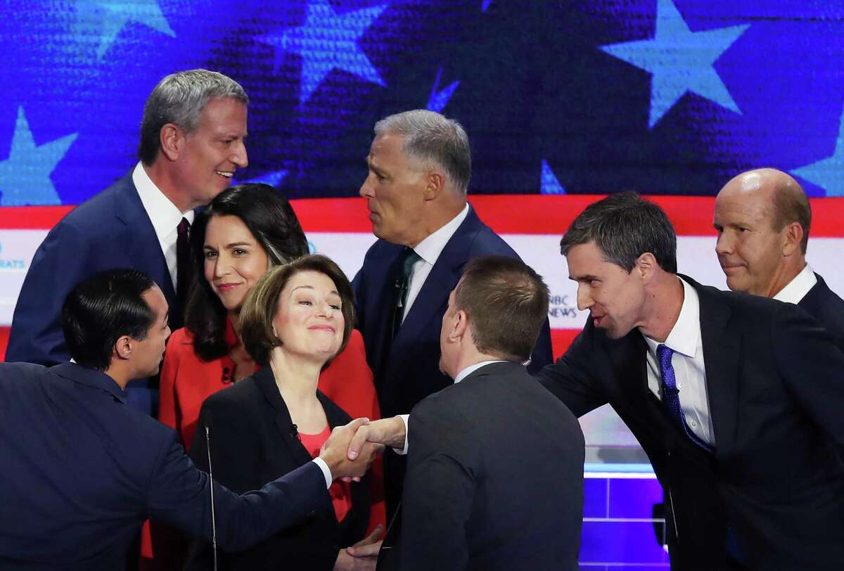MIAMI, FLORIDA - JUNE 26: Chuck Todd of NBC News greets Sen. Amy Klobuchar (D-MN), former housing secretary Julian Castro, former Texas congressman Beto O'Rourke and other candidates after the first night of the Democratic presidential debate on June 26, 2019 in Miami, Florida. A field of 20 Democratic presidential candidates was split into two groups of 10 for the first debate of the 2020 election, taking place over two nights at Knight Concert Hall of the Adrienne Arsht Center for the Performing Arts of Miami-Dade County, hosted by NBC News, MSNBC, and Telemundo. (Photo by Joe Raedle/Getty Images) ***BESTPIX***