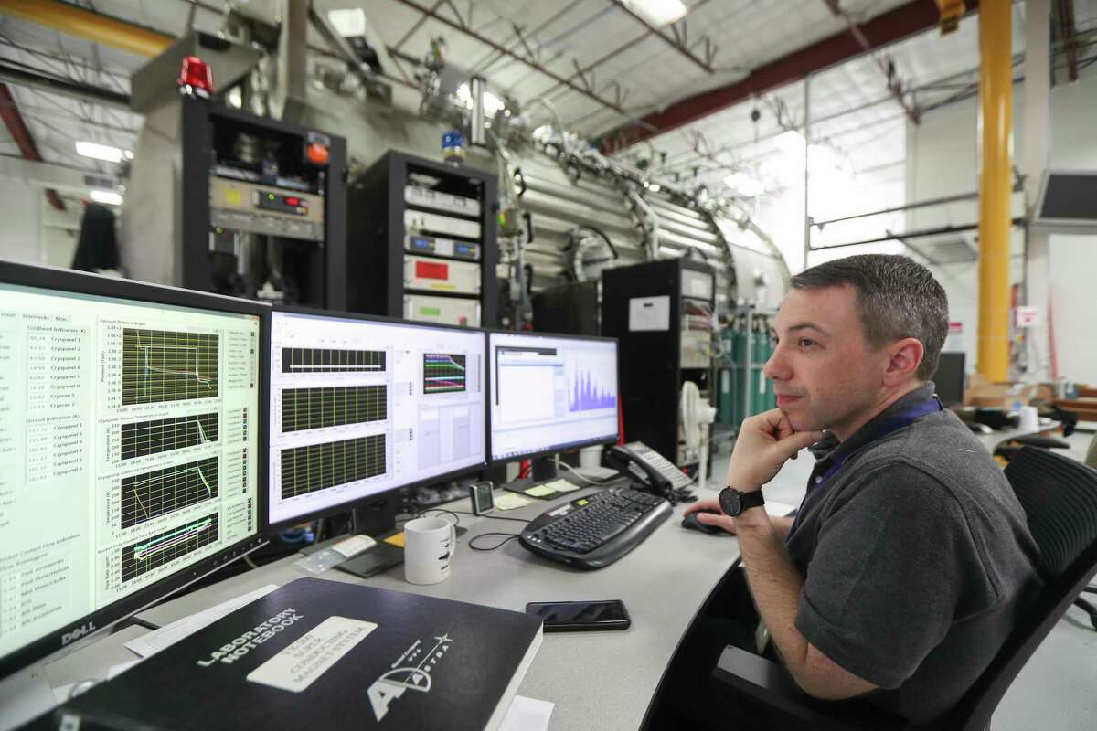 Matthew Giambusso, Ad Astra Rocket Company senior research scientist looks at monitors for the 150 m3 vacuum chamber on June 4, 2019, in Houston. Ad Astra Rocket Co., is working to develop a different kind of rocket engine that would be cheaper and faster than traditional chemical combustion.