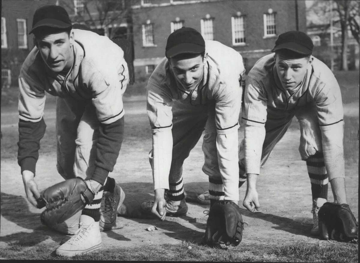 Click through the slideshow of people and places in the Capital Region in 1949. Baseball players pose at Milne High School, Albany, New York - Ed Lux, Ed Segel, and Art Walker. April 05, 1949 (Times Union Archive)
