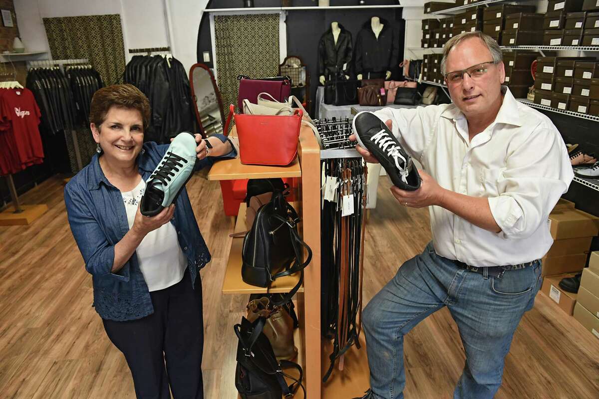 Store owners Susan and Jed Civic hold shoes made from car airbags, left, and Pinatex, which is made from pineapple leaves, right, in their store The Vegan Outfitter on Thursday, June 27, 2019 in Troy, N.Y. This is the only vegan shop in the Capital Region and carries high quality, cruelty-free shoes, jackets, belts, handbags, wallets and more. (Lori Van Buren/Times Union)