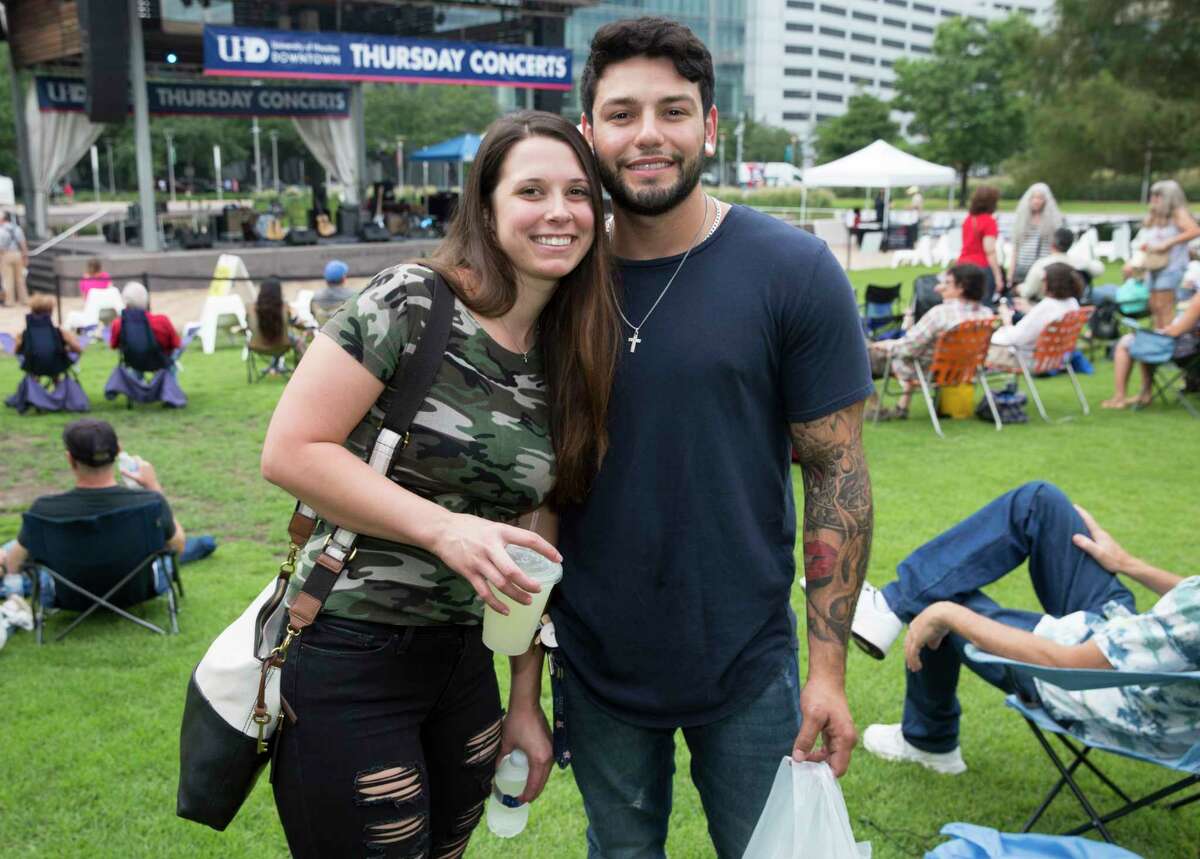 People pose for a photograph before Thursday Night Concerts with Bruce Robison and Kelly Willis at Discovery Green on Thursday, June 27, 2019, in Houston.