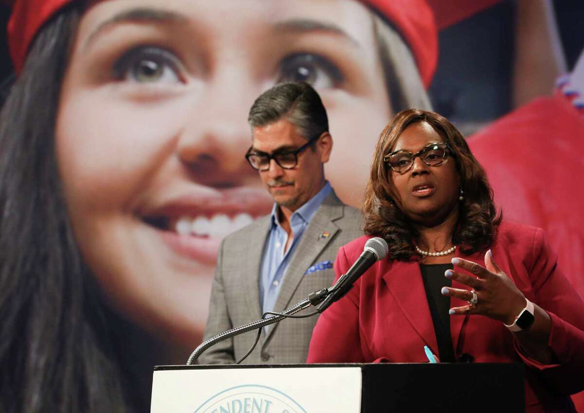 Chief Financial Officer Rene Barajas, left, and Houston Independent School District Interim Superintendent Grenita Lathan talk about proposed salary increases for district employees during a press conference in Houston, Tuesday, June 25, 2019.