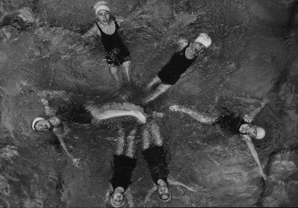 YWCA Albany, Fancy swimming, A class of young swimmers at the YWCA form a star in the water of the Y pool. The swimmers are Elleny Lyons, Dorothy Long, Teresa Tricomi, Marilyn Darrow, Ruth Donner and Sally Garlick. Mrs. Helen Moody was their instructor. January 30, 1949 (Times Union Archive)