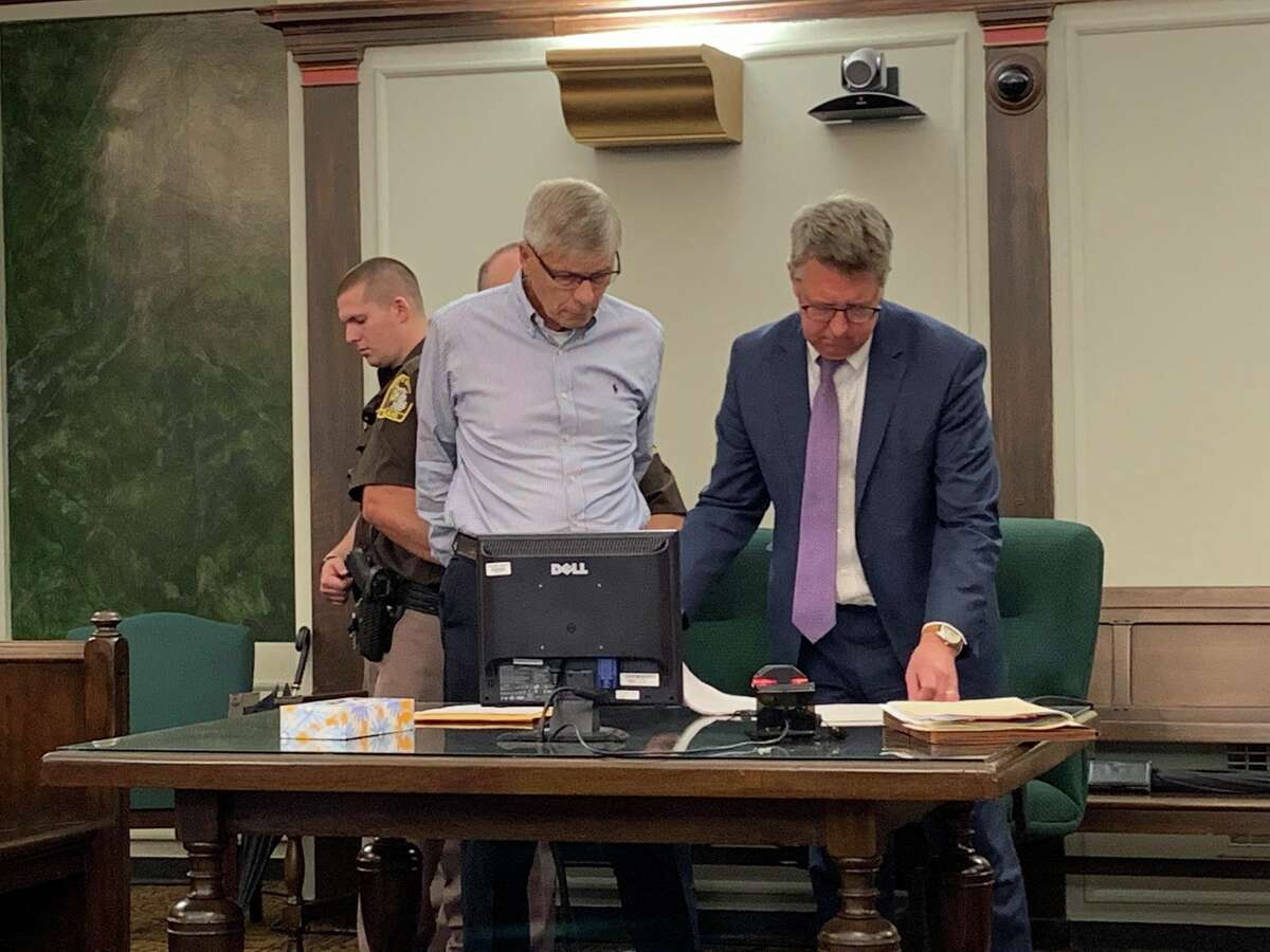 Gary Gatza, left, and his attorney Stephen Durance, right, look over court documents as Gatza is handcuffed by a court officer after being found guilty of four criminal charges, on June 28, 2019 in the 42nd Circuit Court. Gatza, 74, was sentenced to 72 months to 15 years in jail for operating while intoxicated and causing the Jan. 1, 2019, traffic crash that led to the death of Stanley Dulaney Jr. and the injury of the three passengers of Dulaney's vehicle. (Mitchell Kukulka/Mitchell.Kukulka@mdn.net)