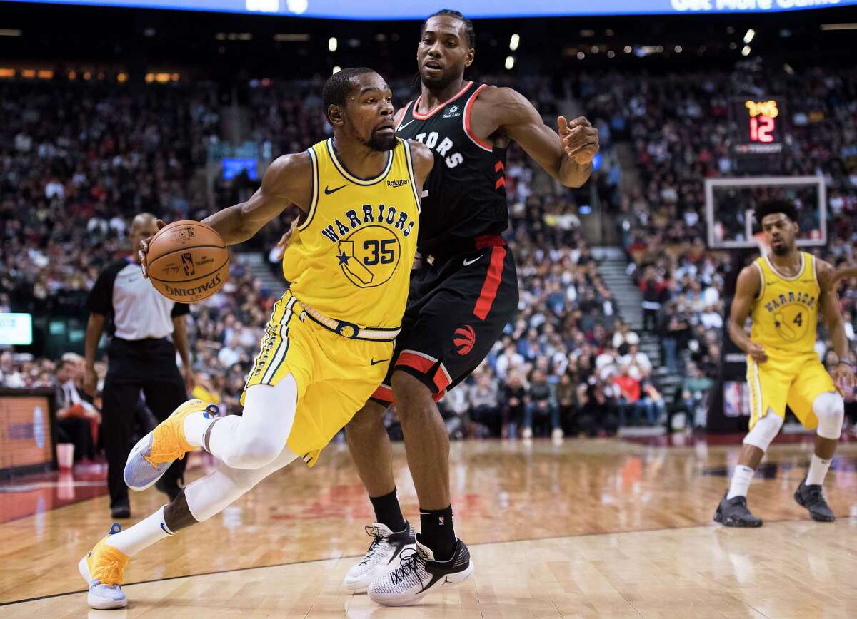 Kevin Durant (35) and Kawhi Leonard are two of the marquee players available in this year's blockbuster free-agent class. Free agents can begin reaching verbal agreements with teams at 5 p.m. CT Sunday and can officially sign beginning July 6.