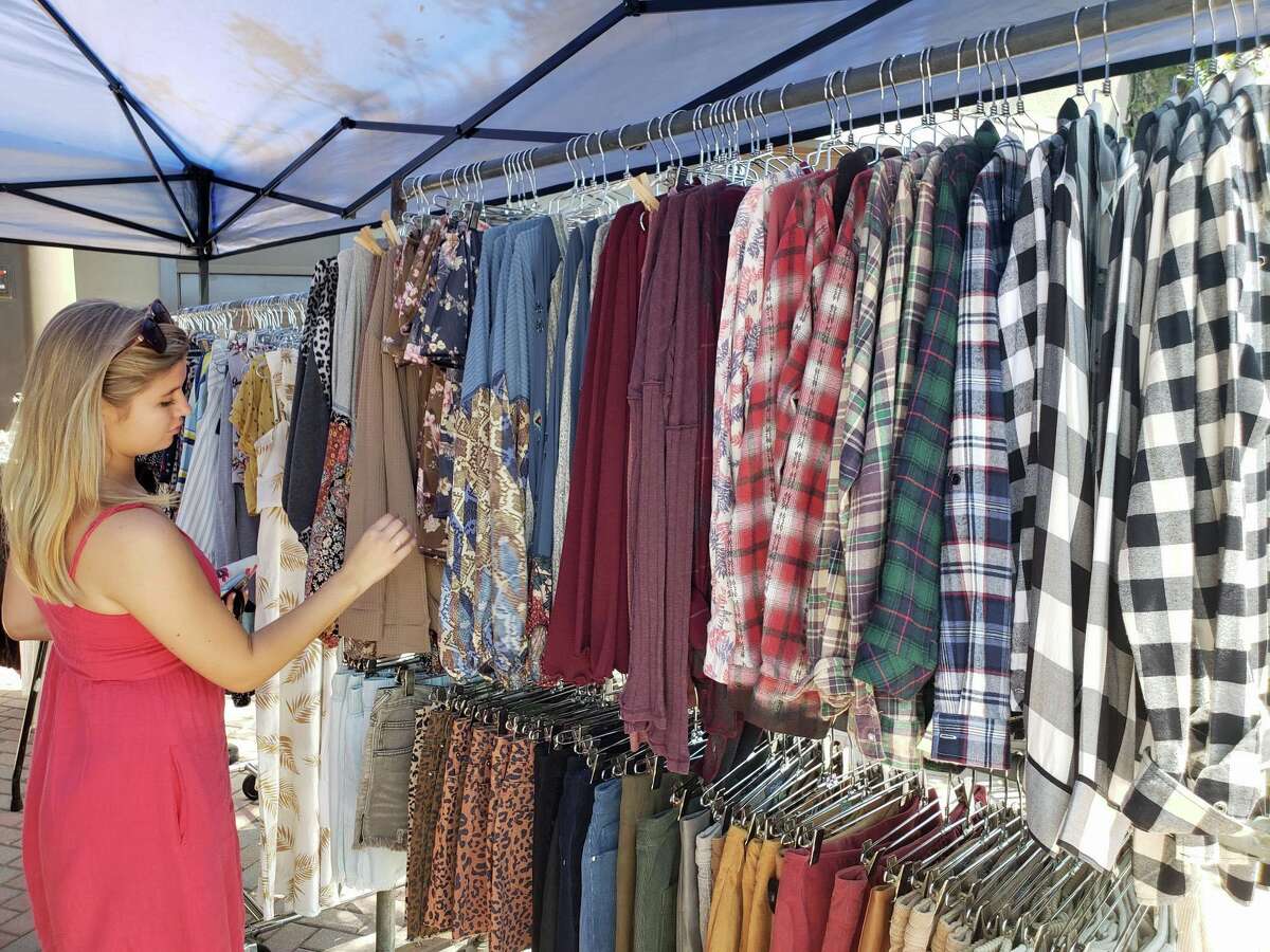 Savannah Mather, of Southbury, shops outside Oddz during the annual Westport Sidewalk Sale throughout Main Street, Post Road and areas surrounding downtown on June 28, 2019.