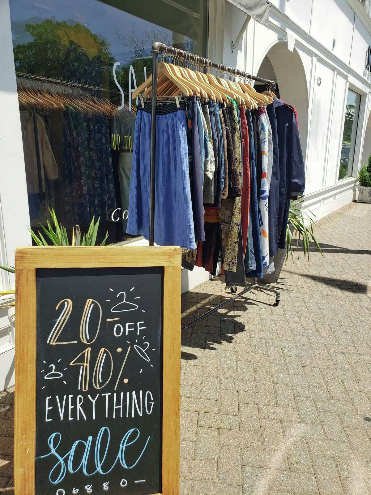 Sale items are on display outside Cotelac during the annual Westport Sidewalk Sale throughout Main Street, Post Road and areas surrounding downtown on June 28, 2019.