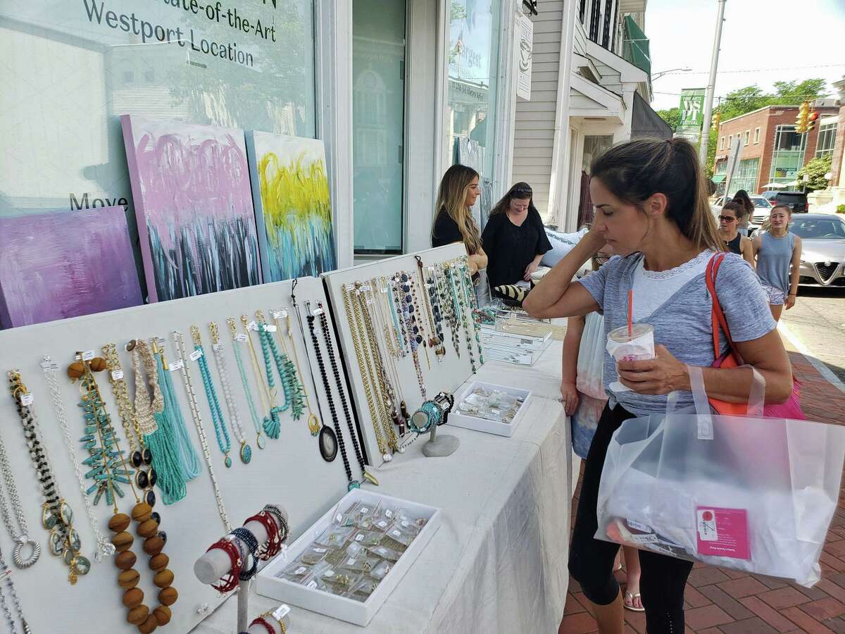 Shoppers peruse during the annual Westport Sidewalk Sale throughout Main Street, Post Road and areas surrounding downtown on June 28, 2019.