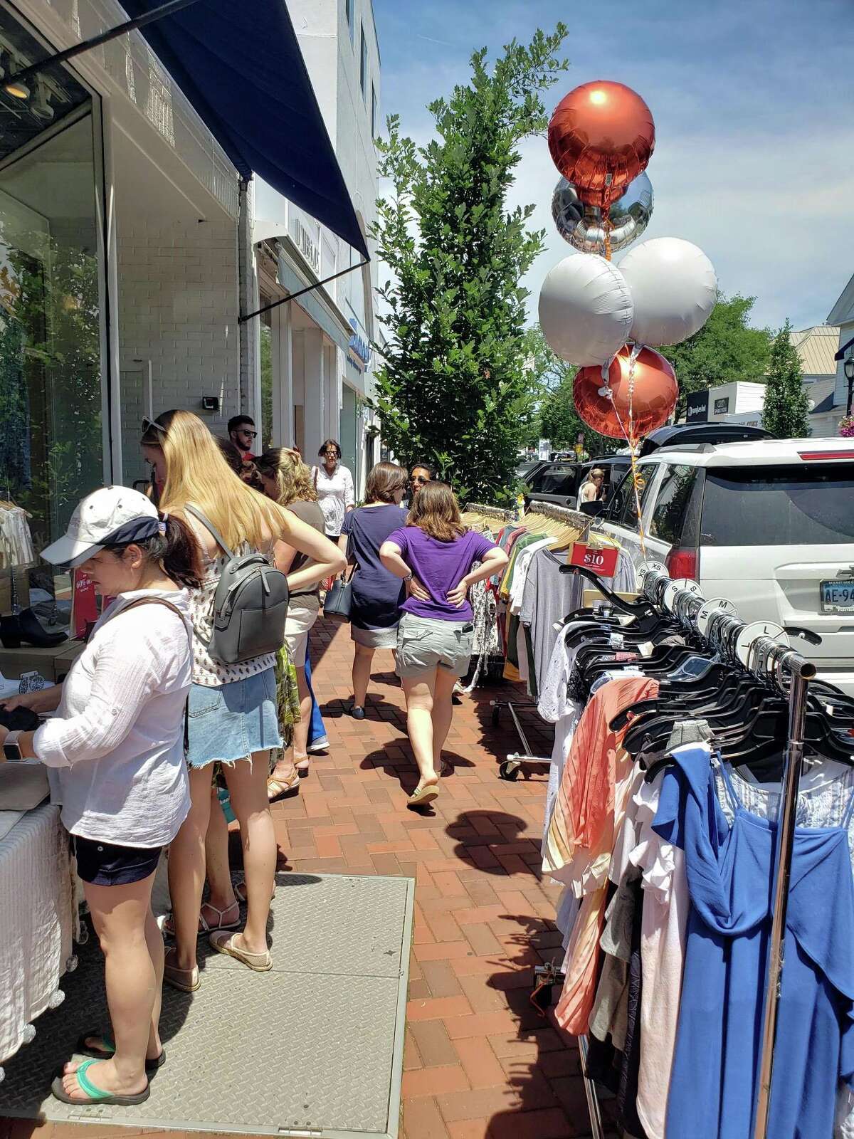 Shoppers peruse during the annual Westport Sidewalk Sale throughout Main Street, Post Road and areas surrounding downtown on June 28, 2019.