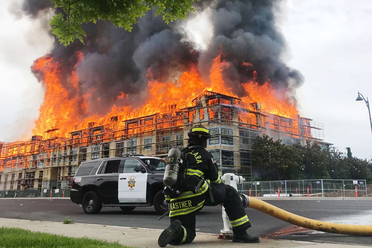 A massive blaze broke out Friday morning at a housing construction site on El Camino Real near Scott Boulevard in Santa Clara.