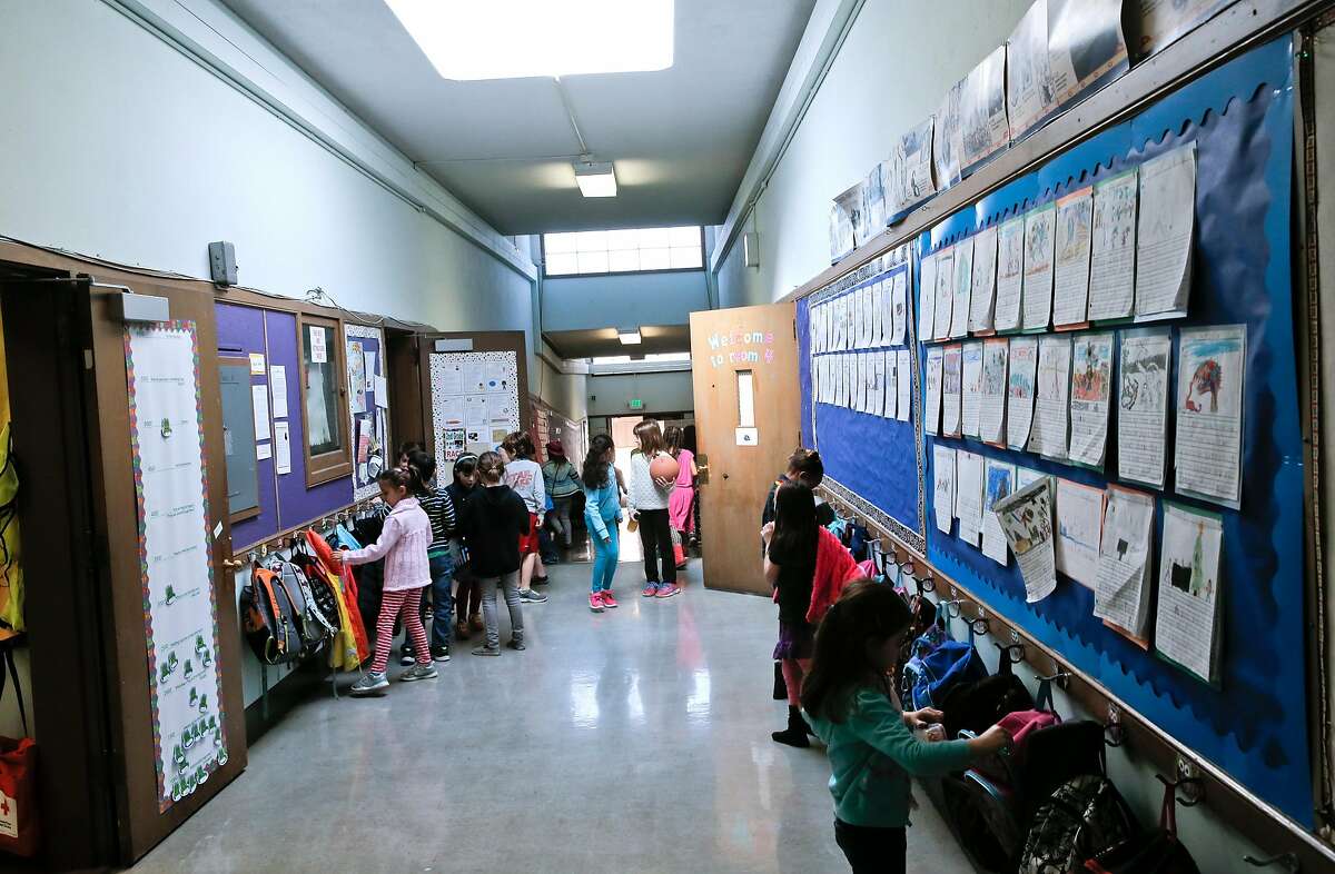 Students fills the hallways as they break for recess at Montclair Elementary School in Oakland, Ca. on Tuesday Feb. 3, 2015. Teachers at several Oakland schools are pressuring the Oakland School district to compensate teachers appropriately during contract negotiations.