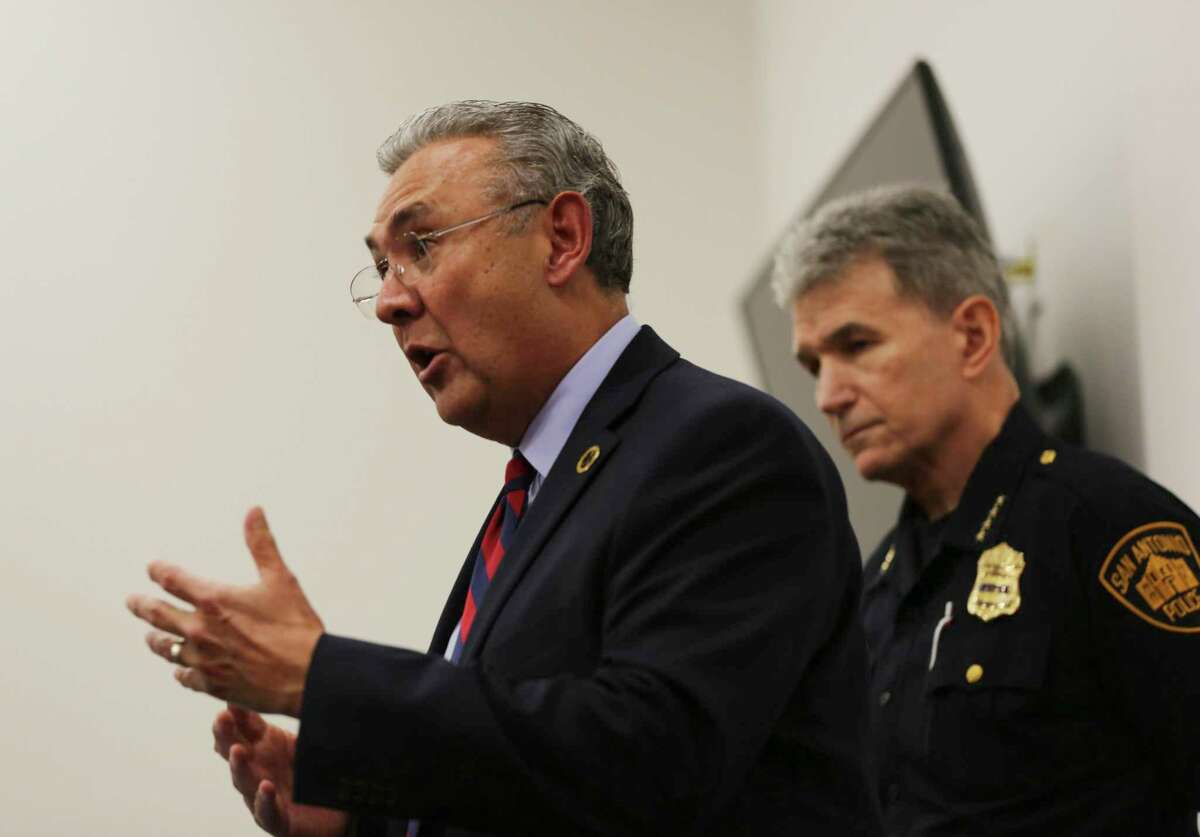 Bear County District Attorney Joe Gonzales, left, describes a new program that gives police officers the discretion to issue citations to people for low-level crimes rather than arrest them. He spoke at the news conference June 28, 2019, at the Bexar County Reentry Center in San Antonio. San Antonio Police Chief William McManus, right, supports the program, saying it will free up police officers’ time to pursue more serious crime.