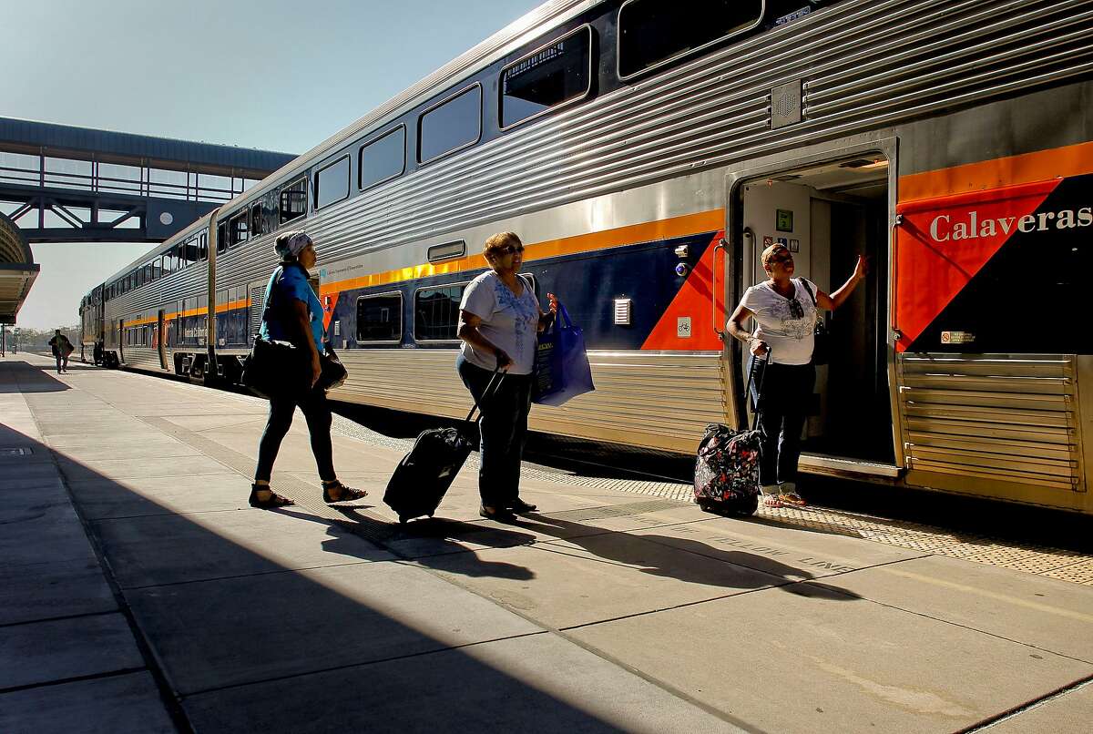 (l to r) Johnita Bell, Diane Ferguson and Linda Tucker, board the San Joaquin Amtrak train bound for Bakersfield, Calif., at the Jack London Square train station, in Oakland, Calif., on Wednesday August 29, 2012. Californians continue to be increasing their travel at least over the holidays. For Labor Day, AAA is expecting travel by car, train and plane to be up 3.78 percent over last year's numbers.